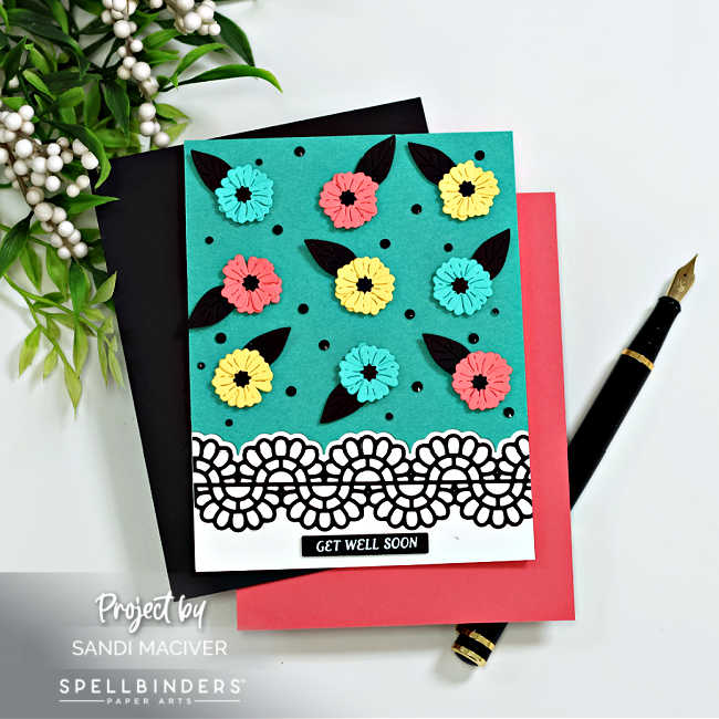 hand made cards with turquoise backgrounds and pink and yellow flowers with black leaves