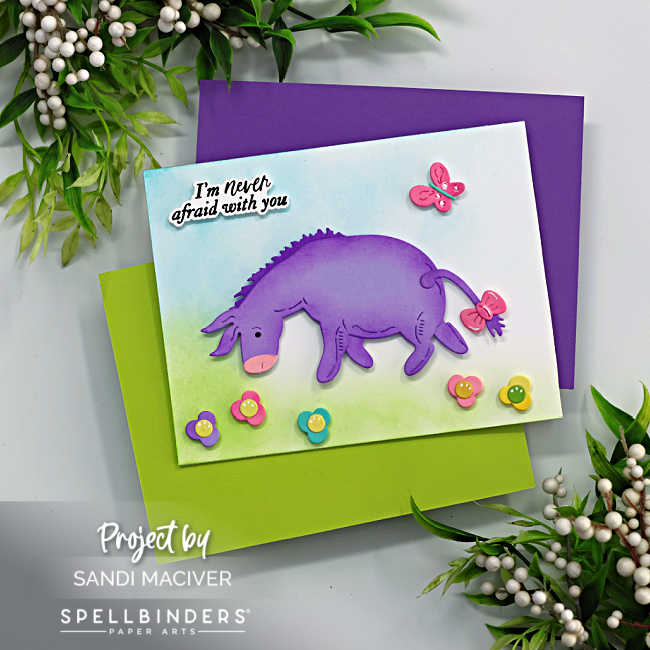 Purple and Pink Eeyore, standing in a field of flowers with a butterfly flying overhead