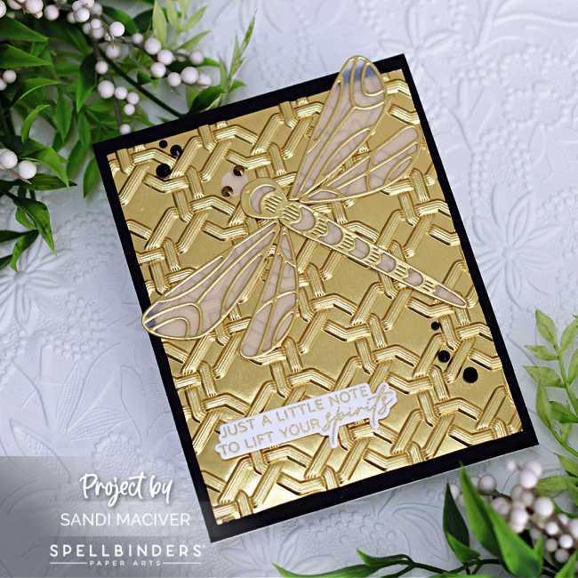 hand made gold and black card base with a vellum and gold die cut dragonfly on top and a support sentiment in gold and white