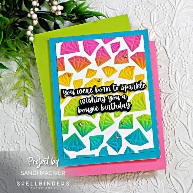 a hand made birthday card with a rainbow of embossed diamonds cascading down the front and a black and white sentiment in the center