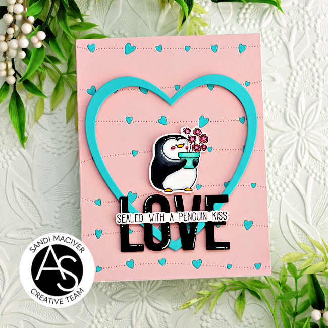 hand made pink card with blue inlaid hearts, a large overlay blue die cut heart with a black and white penguin holding a pot of roses