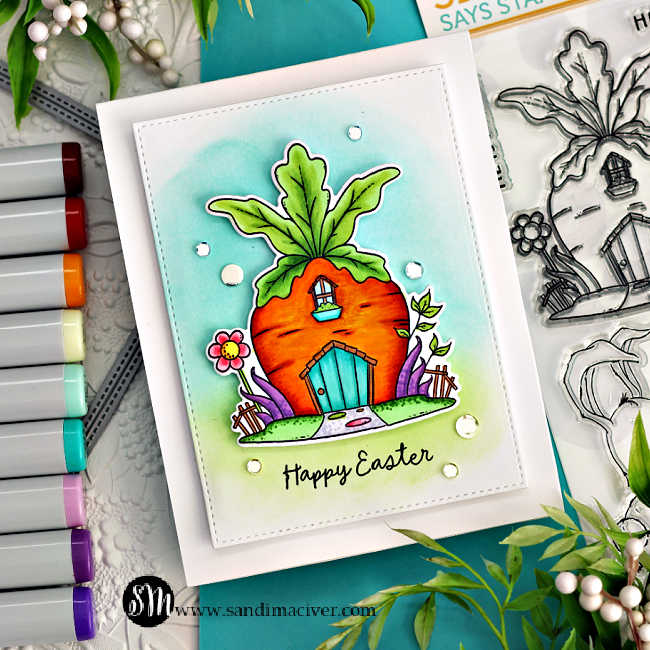 @simonsaysstamp copic colored carrot house surrounded by greenery and grass attached to a white card base ink blended with green and blue ink