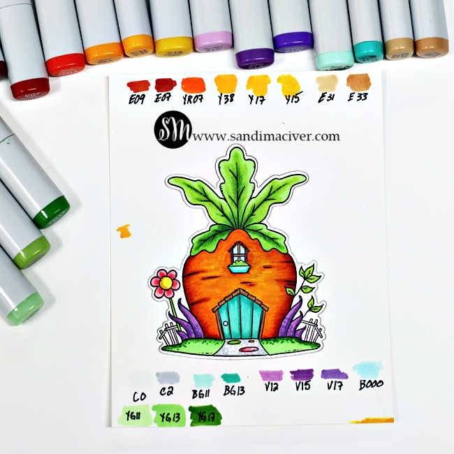 @simonsaysstamp copic colored carrot house surrounded by greenery and grass attached to a white card base ink blended with green and blue ink