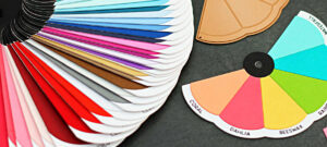 picture of a swatched rainbow of colored cardstock with a black background