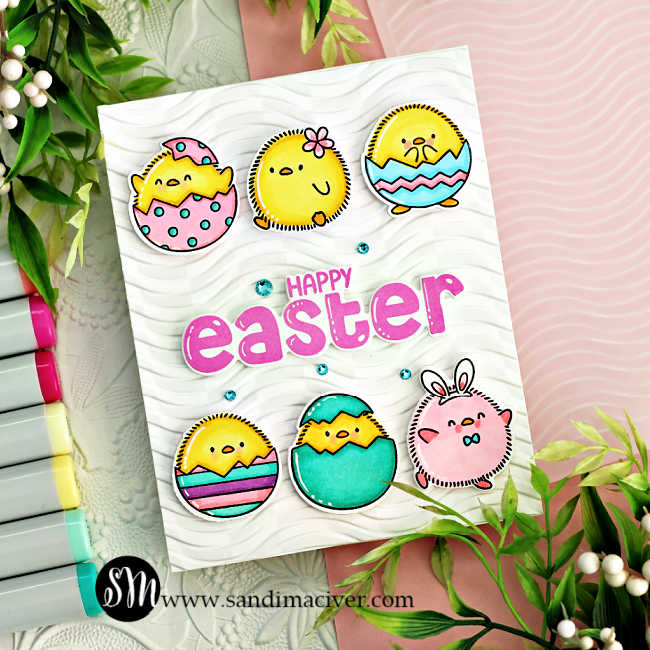 hand made white easter card with 6 colored and die cut chicks in eggs and a pink sentiment