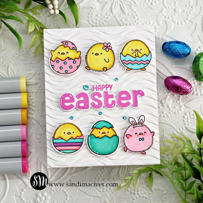 hand made white easter card with 6 colored and die cut chicks in eggs and a pink sentiment