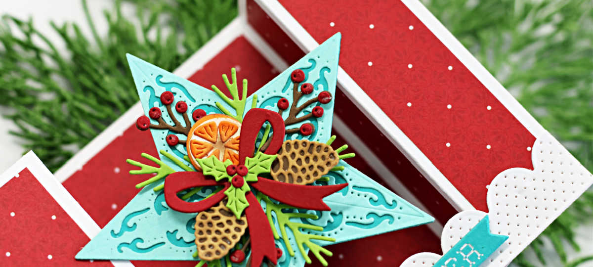 festive handmade Christmas bridge card featuring a dimensional teal star embellished with die-cut pinecones, holly, berries, orange slices, and a red bow. The card base is decorated with red and white polka dot panels and pierced white edging."