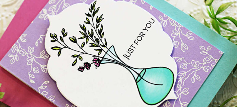 Handmade card featuring a Simon Says Stamp wildflower image in a teal vase, colored with Copic markers. The violet background is white heat embossed with a leafy design to mimic coordinating wallpaper. Sentiment "Just for You" is stamped in black on a decorative die-cut panel. Elegant and clean design using new Simon Says Stamp products.