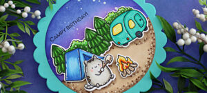 Handmade scalloped circle card featuring a camping scene created with Simon Says Stamp Cute Campers stamps and dies. The design is colored with Copic markers and includes a gray cat roasting marshmallows by a campfire, a blue tent, and a turquoise camper set against a night sky with pine trees. The sentiment reads “Campy Birthday!” and the card has a playful round shape with a teal scalloped edge.