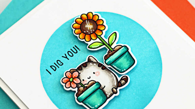Handmade card featuring a cute stamped cat from the Simon Says Stamp Rooting for You stamp and die set, holding a potted flower alongside a second potted sunflower. Both images are colored with bright Copic-style shading. The background is ink-blended in teal through a circle mask, and the sentiment “I DIG YOU!” is stamped on the left side.