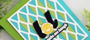 Handmade card featuring a white Dual Diamonds lattice die-cut panel with alternating blue and green inlaid diamonds. The card is mounted on a bright green base with a bold black “LOL” and yellow laughing emoji face in the center, accented by a sentiment strip that reads “make me laugh.”