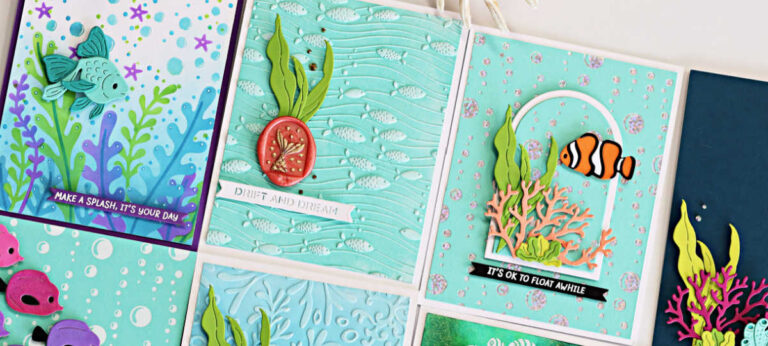 Handmade underwater-themed greeting cards created with the Spellbinders August Club Kits. Designs feature colorful die-cut fish, coral, and seaweed with embossed ocean backgrounds. Sentiments include ‘Make a Splash, It’s Your Day,’ ‘Drift and Dream,’ and ‘It’s OK to Float Awhile.’ The cards showcase vibrant aquatic scenes with layered die cuts, bubbles, and textured details