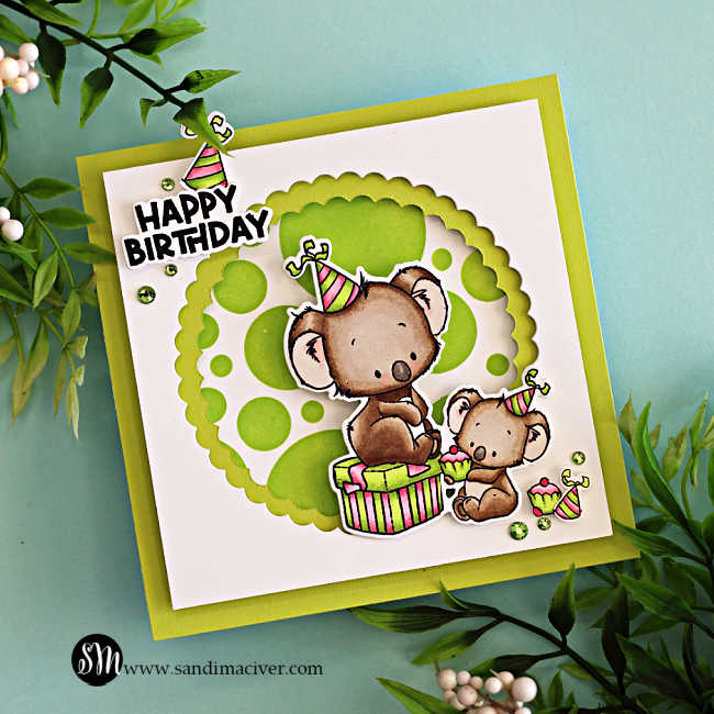 Handmade square birthday card featuring two adorable koalas from the Simon Says Stamp Koala-ty Birthday stamp and die set, part of the Sugar and Spice release. The design includes a bright lime green ink-blended background created with the Mix and Match Circles Stencil and a layered scalloped circle frame die-cut using the Scalloped Circles Nested Die Set. The larger koala sits on a striped gift box while the smaller one holds a cupcake, both wearing colorful party hats. A bold “Happy Birthday” sentiment and green gem embellishments complete the cheerful, playful design by Sandi MacIver.