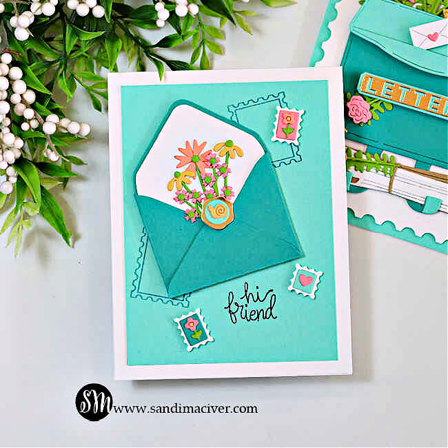 Alt text: Handmade card created with the Hero Arts My Monthly Hero kit featuring a teal envelope with a floral note inside, layered over a teal background with postage-stamp accents and the stamped sentiment “hi friend.”
