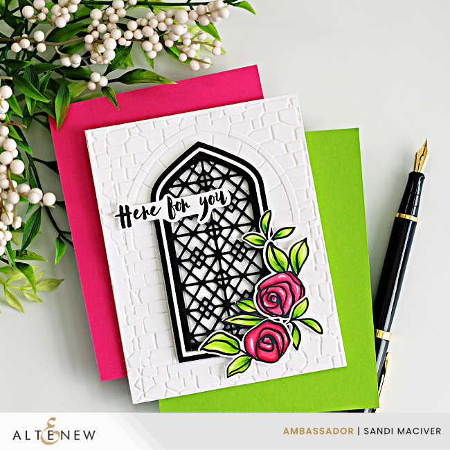Handmade white A2 card featuring the Altenew Enchanted Castle Window 3D Embossing Folder and Gothic Arches Die Set, layered with a black lattice window over a stone-embossed background. A pink Bamboo Rose floral cluster with bright green leaves accents the lower right corner, and a “Here for you” sentiment is placed across the arch.