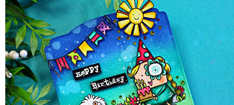 Colorful MemoryDex birthday card featuring a blue-to-teal ink blended background with splatter detail, festive banner flags, and a smiling sun. A cute girl in a party hat holds a birthday cake with candles beside a fluffy white dog, surrounded by bright flowers and green grass. The sentiment “Happy Birthday” appears on black labels in the center.