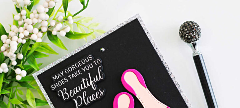 Handmade card featuring bright fuchsia high-heel shoes created with the Alex Syberia Designs Chic Shoes Die Set, each finished with silver glitter bows. The shoes are layered on a black card front with a silver glitter frame, and a white BetterPress sentiment from the Shoes Sentiments BetterPress Plates reads “May gorgeous shoes take you to beautiful places.” Small crystal gems add sparkle to this elegant fashion-themed card.