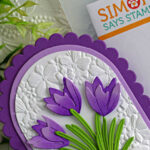 Crocus die cut card featuring purple crocus flowers with embossed background using Simon Says Stamp Fresh Crocus Duo Die Set and scalloped arch dies