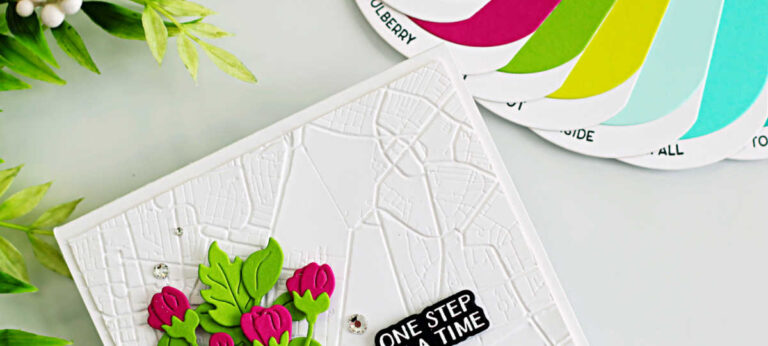 Handmade A2 card featuring the Spellbinders Classic Kicks Large Die of the Month (March 2026). A teal die-cut sneaker with white laces sits on a white background embossed with the Urban Grid 3D Embossing Folder of the Month. The sneaker is filled with layered pink and red flowers and bright green leaves spilling from the top. A small black sentiment strip reading “One Step at a Time,” from the Good Times Clear Stamp and Die of the Month, is placed to the right, with a few silver gems scattered for sparkle.