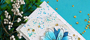 Mixed media slimline card featuring Altenew Sulfur Cosmos with stenciling, white relief paste texture, and blue ink splatter on a white card front