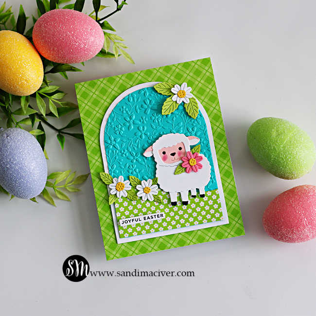 Cute Easter lamb card made with the Simon Says Stamp Sweet Sheep die and A2 Arches dies, featuring a layered sheep with flowers on an embossed arch panel and bright spring patterned paper.