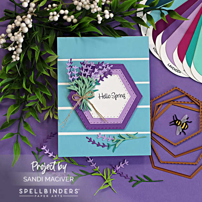 Die cut lavender card with layered hexagon design, striped background, and purple and mint lavender sprigs arranged as a bouquet with Hello Spring sentiment.