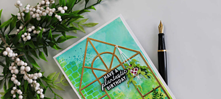 Greenhouse birthday card featuring Hero Arts My Monthly Hero with ink smooshed background, gold greenhouse die cut, hanging plant and plantastic birthday sentiment