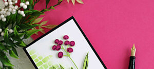 mini slimline floral card using Hero Arts My Monthly Hero April Kit with stenciled background black heat embossed vase and hand drawn floral details