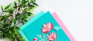 Elegant lotus flower card in pink and teal with layered die cut flowers on a blended background, perfect handmade card idea for cardmaking inspiration
