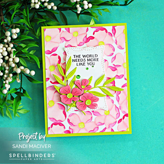 Poppy Song handmade die cut greeting card with stenciled floral background, layered flowers, and The World Needs More Like You sentiment by Spellbinders