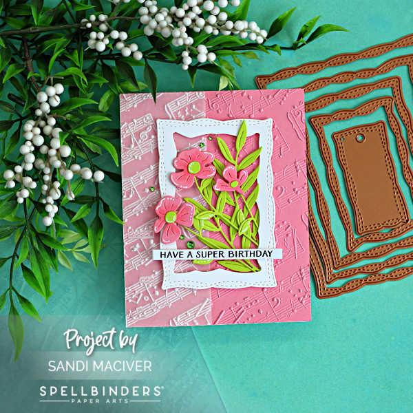 Poppy Song handmade die cut greeting card with pink embossed background, layered floral die cuts, and birthday sentiment by Spellbinders