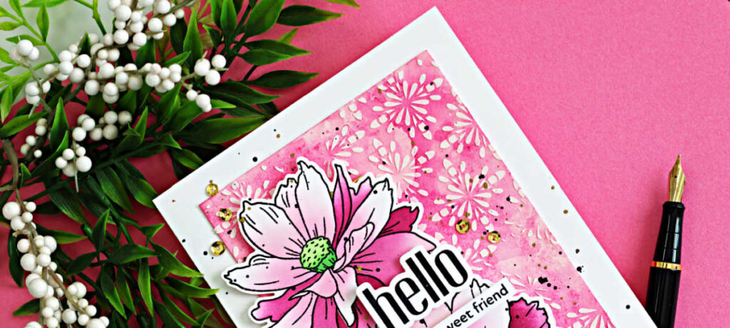 Sulfur Cosmos card featuring ink blended stenciled flowers layered over a pink ink smooshed background with white relief paste texture and splatter details