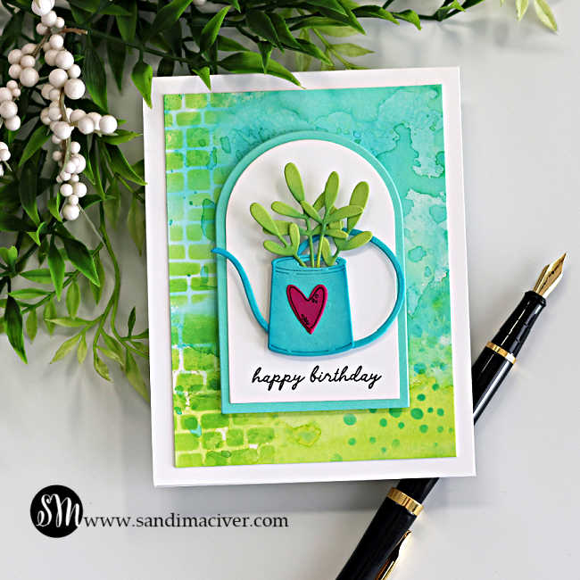 Watering can birthday card featuring die cut watering can with foliage, ink smooshed Distress Oxide background, and clean and simple design.