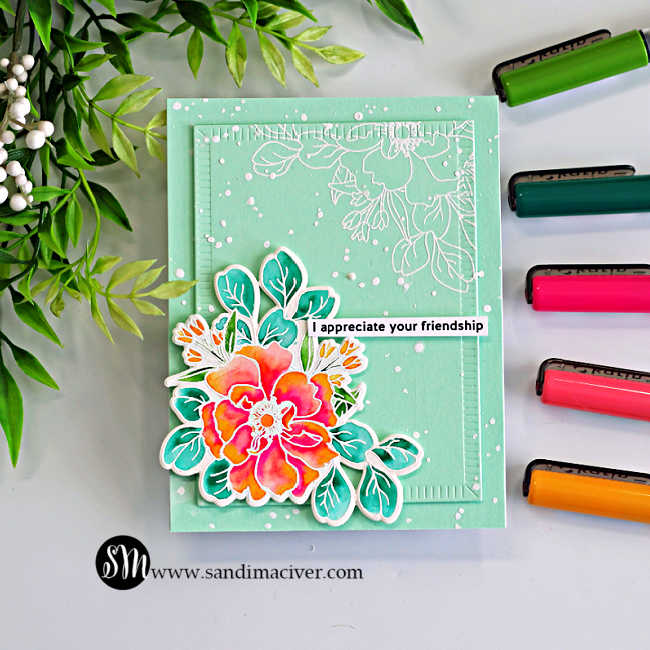 Messy watercolor wild rose card with bright pink and coral floral cluster, teal leaves, and white embossed background on mint cardstock, shown with Karin markers used for the watercolor technique.