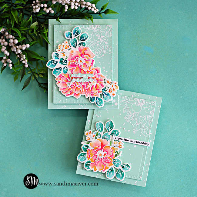 Two handmade floral cards featuring watercoloring with Karin Markers and the Simon Says Stamp Wild Rose stamp set, with vibrant pink and coral flowers, teal leaves, mint cardstock layers, and white splatter details on an aqua background.
