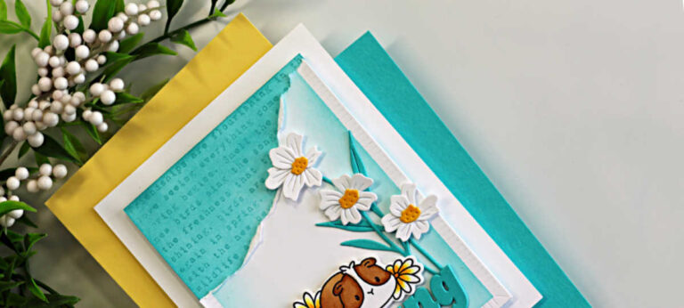 Close-up of a clean and simple handmade card featuring a turquoise ink-blended background with torn paper edges, white die cut daisies, and layered texture details. The card uses minimal colors with Audrey Blue accents and subtle tone-on-tone stamping for added interest.
