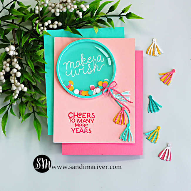 birthday balloon shaker card with teal shaker balloon, colorful confetti, and tassel die cut accents on pastel cardstock by Hero Arts