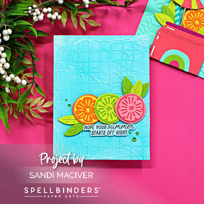 Bright summer handmade card featuring layered citrus slice die cuts and green leaves on a turquoise embossed background with the sentiment “Hope Your Summer Starts Off Right,” created with the Spellbinders May Clubs.