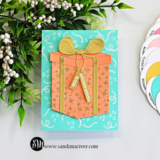 Easy birthday card idea featuring the Hero Arts My Monthly Hero Big Present Die Set with a large peach die cut gift box, gold heat embossed stars, metallic gold bow and ribbon, and an aqua confetti background created with heat embossing.