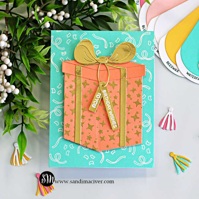 Easy birthday card idea featuring the Hero Arts My Monthly Hero Big Present Die Set with a peach die cut gift box, gold heat embossed details, aqua confetti background, layered gold bow, and bright cardstock color combo inspiration.