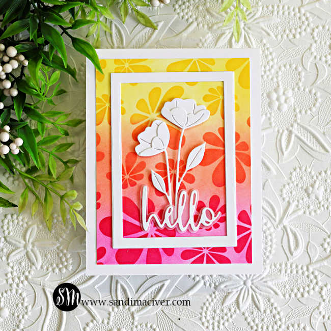 Bright handmade Hello Spring card featuring Retro Daisies stencil blending in yellow, orange, and pink inks with layered white Arctic Poppies die cuts, a dimensional white frame, and a bold hello sentiment 