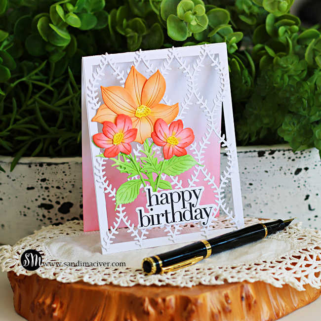 Peek-a-boo see-through floral birthday card featuring the Simon Says Stamp Willowweave Plate with layered Luna Flower and Sunblush Flowers dies in peach, coral, and green over a soft pink background with a bold happy birthday sentiment.