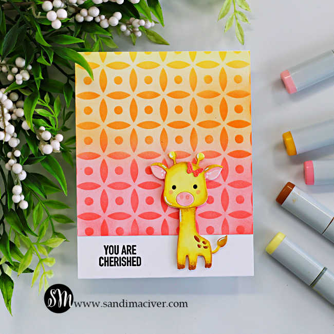 Handmade giraffe card featuring a yellow die-cut giraffe on a bright yellow, orange, and pink ink-blended Dot Petal Pattern stenciled background with a “You Are Cherished” sentiment and coordinating Copic markers beside the card.