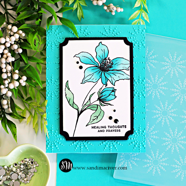 Handmade floral sympathy card featuring turquoise blue flowers from the Wild and Free stamp set framed with black and white A2 Notched Rectangle die cuts on an embossed Audrey Blue background with black gems and a healing thoughts sentiment.