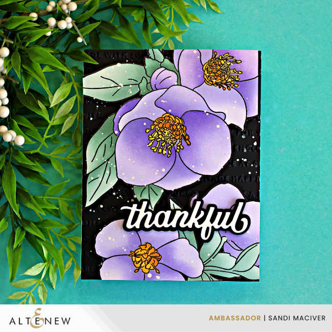 Handmade floral thank you card featuring large lavender flowers and soft mint green leaves from the Altenew Lenten Grace Stamp and Stencil Set. The florals are layered over a black embossed background with a bold white "thankful" sentiment. The card is photographed with Altenew ink pads and blending brushes on a turquoise background with decorative greenery.
