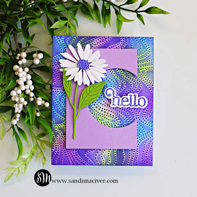 Handmade greeting card featuring the Embossed Joseph's Coat technique with the Dotty Contour Embossing Folder. A vibrant embossed background in shades of purple, blue, and lime green is topped with a lavender die-cut panel featuring a curved peek-a-boo window that frames a layered "hello" sentiment. A white daisy with green leaves completes the elegant design.