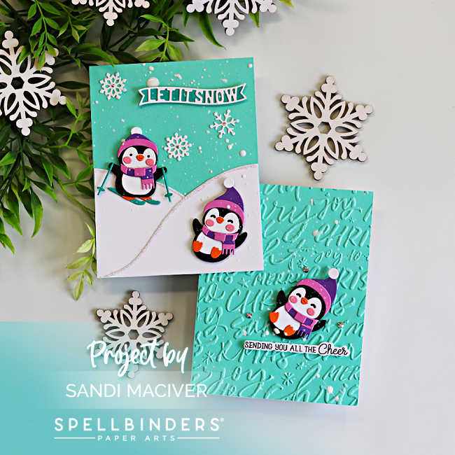 Two handmade Christmas cards featuring the Spellbinders Snow Much Fun penguins. One card shows skiing and sledding penguins on snowy hills beneath a teal sky with a "Let It Snow" sentiment, while the second features a playful penguin on a teal background embossed with the Festive Greetings 3D Embossing Folder and a "Sending You All the Cheer" sentiment.