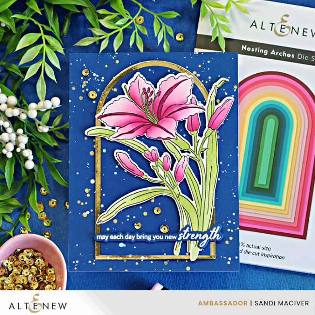 Close-up of a handmade Dark and Moody floral card featuring the Altenew Leaning Lily stamp, stencil, and die bundle. A vibrant pink lily is framed by a gold arched die cut on a deep navy background with gold splatter and sequins, displayed beside the Altenew Nesting Arches Die Set packaging.