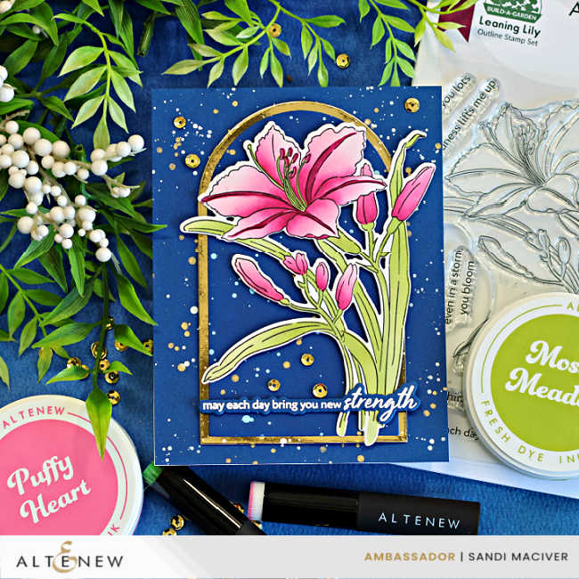 Dark and Moody handmade floral card featuring the Altenew Leaning Lily stamp, layering stencils, and coordinating die. A vibrant pink lily is framed by a gold arched die cut on a deep navy background with white and gold splatter, displayed alongside the Leaning Lily stamp set, Altenew ink pads, blending brushes, and gold sequins.