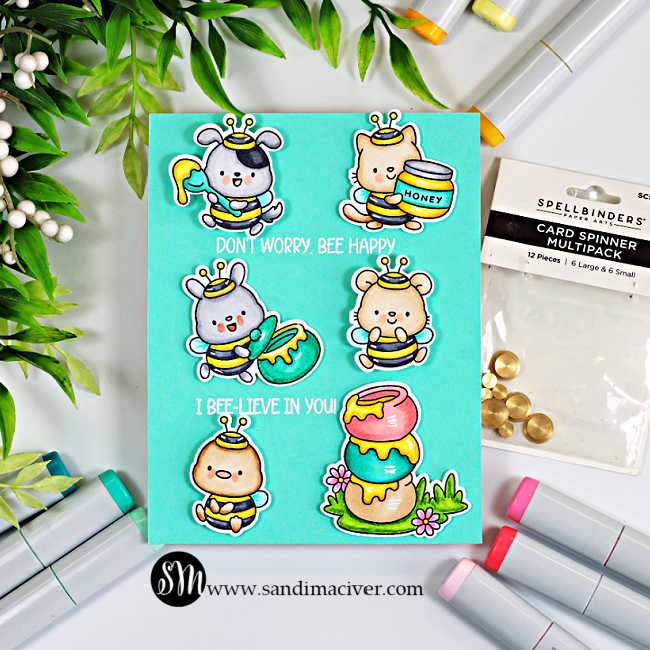 Seafoam teal interactive card featuring Copic-colored critters dressed as bees, stacked honey pots, white embossed sentiments, and Spellbinders Card Spinners used to create movement.